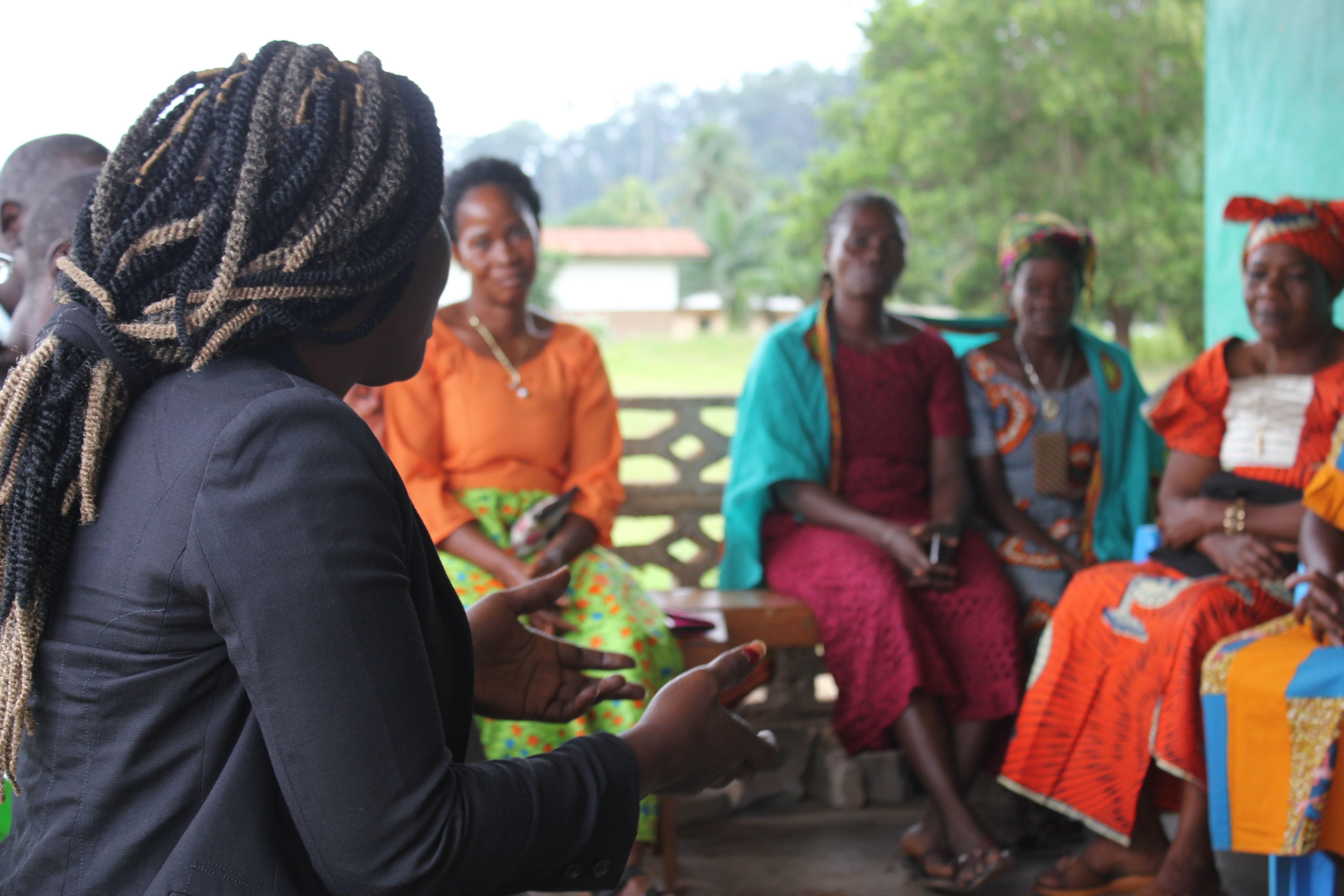 Group of 5 women sitting in a circle in Liberia.